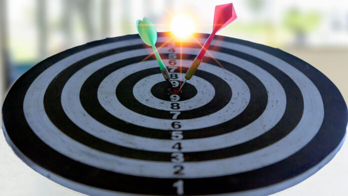 Target,Boards,With,Arrows,At,Sunset