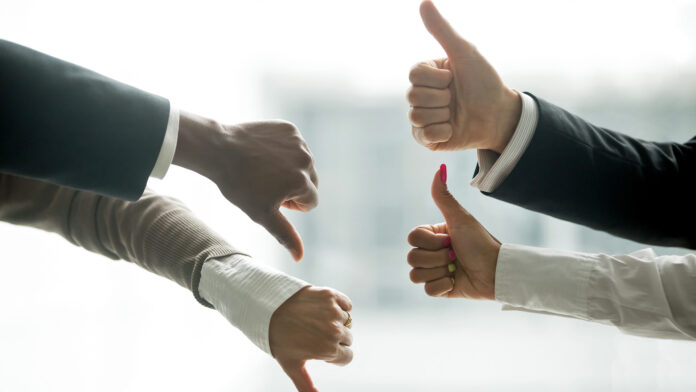 Hands,Of,Diverse,Business,People,Showing,Thumbs,Up,And,Down,