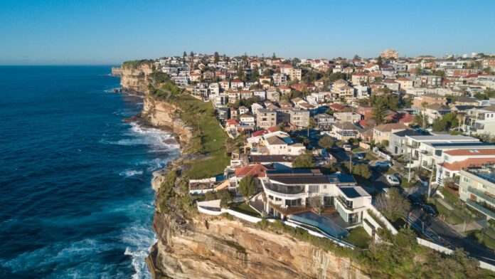 Residential homes in Sydney, Australia Aerial view of residential area across rock cliff area in Sydney coastline