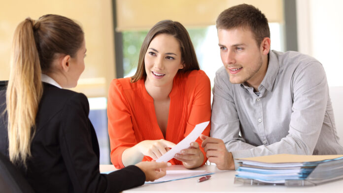 Two,Happy,Customers,Solving,Doubts,About,A,Contract,With,The