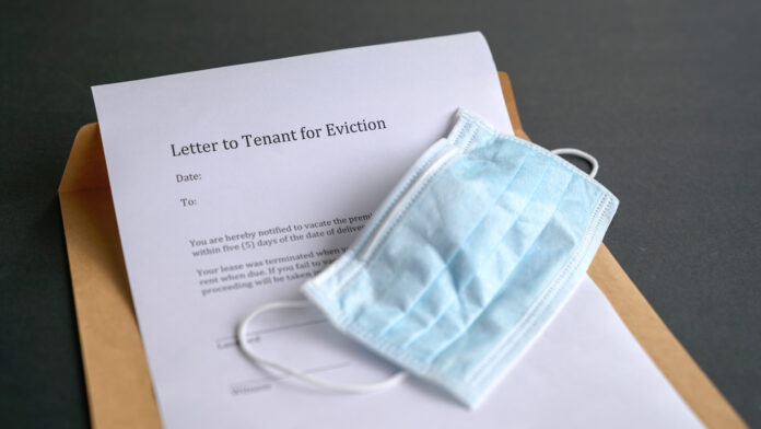 Eviction,Notice,With,Face,Mask,On,Top,Of,Envelope.,Financial