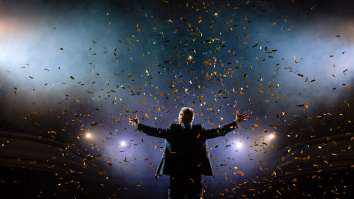 Successful,Businessman,With,Arms,Up,Celebrating,His,Victory.,Celebrating,Success.