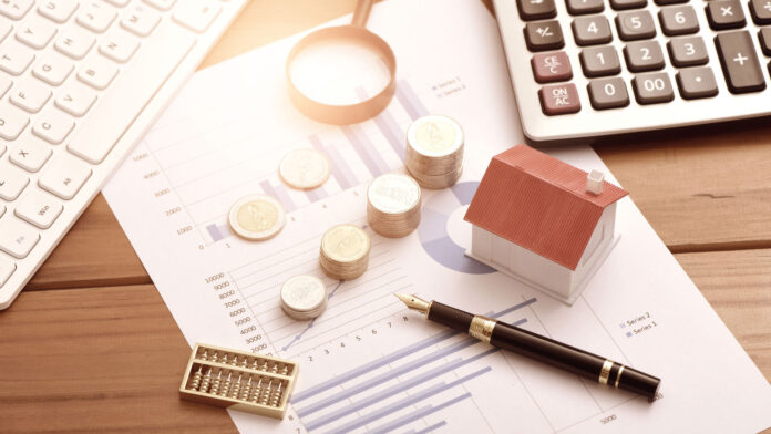 Small,Houses,,Coins,And,Office,Supplies,On,Financial,Statements