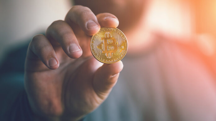 Cryptocurrency,Golden,Bitcoin,Coin.,Man,Holding,In,Hand,Symbol,Of