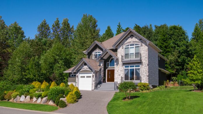 Luxury,Family,House,With,Landscaping,And,Blue,Sky,Background