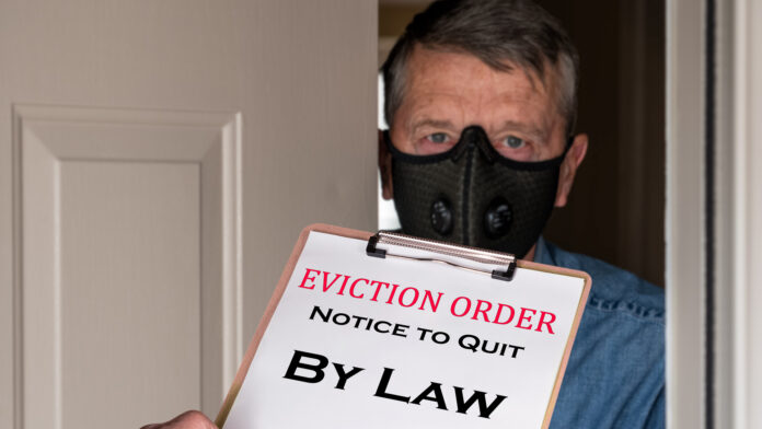 Open,Front,Door,With,Man,In,Suit,Handing,An,Eviction