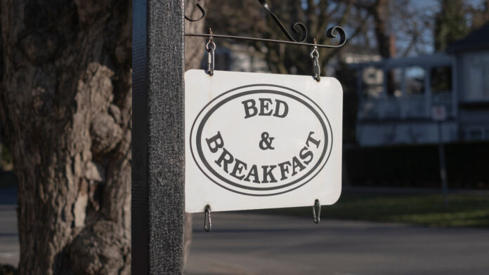 Bed,And,Breakfast,Sign,In,Tourist,Town.,Selective,Focus,,Blurred