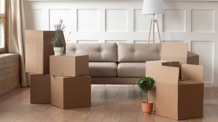 Moving,Day,Concept,,Cardboard,Carton,Boxes,Stack,With,Household,Belongings