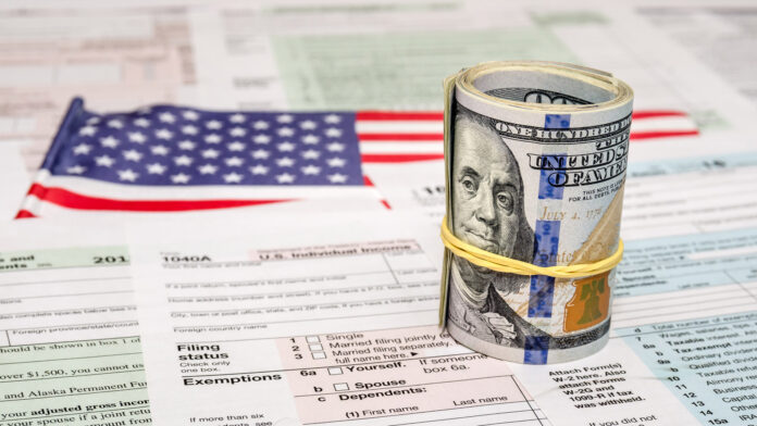 Us,Federal,Income,1040,Tax,Return,Form,With,Money,And