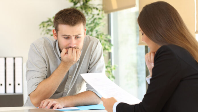 Nervous,Man,Looking,How,The,Interviewer,Is,Reading,His,Resume
