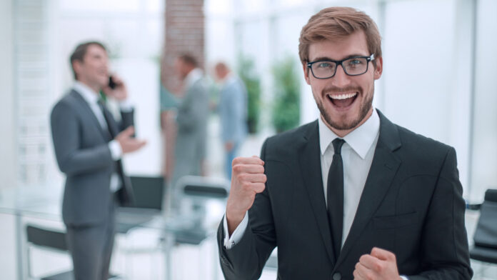 Close,Up.,Happy,Confident,Businessman,Standing,In,Office