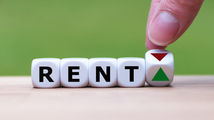 Symbol,For,Increasing,Rent.,Hand,Is,Turning,A,Dice,And