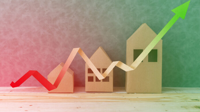 House,Concept,With,House,Shape,Cardboard,On,Wooden,Floor,And