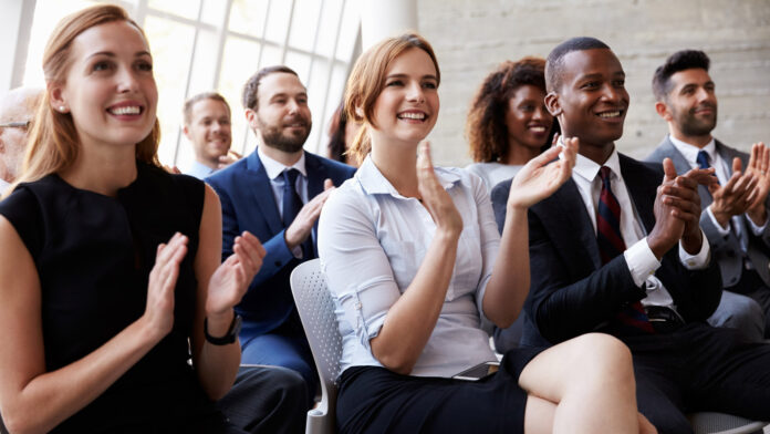 Audience,Applauding,Speaker,At,Business,Conference