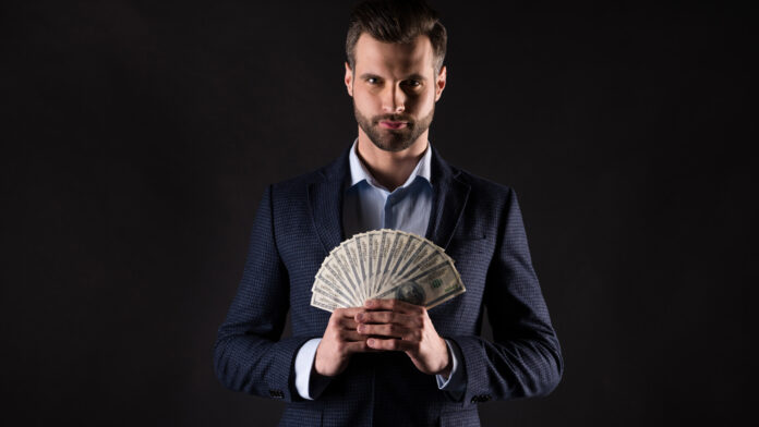 Photo,Of,Attractive,Handsome,Business,Guy,Hold,Hands,Fan,Of