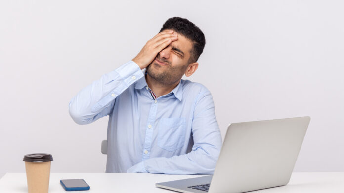 Facepalm.,Depressed,Businessman,Sitting,Office,Workplace,,Keeping,Hand,On,Forehead,