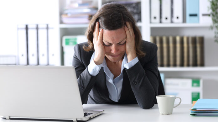 Sad,Adult,Executive,Woman,With,Laptop,Complaining,Sitting,On,A