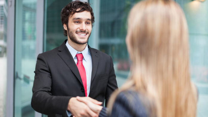 Young,Smiling,Business,People,Shaking,Hands