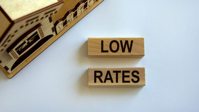 Wooden,Blocks,Form,The,Words,'low,Rates',Near,Miniature,House.