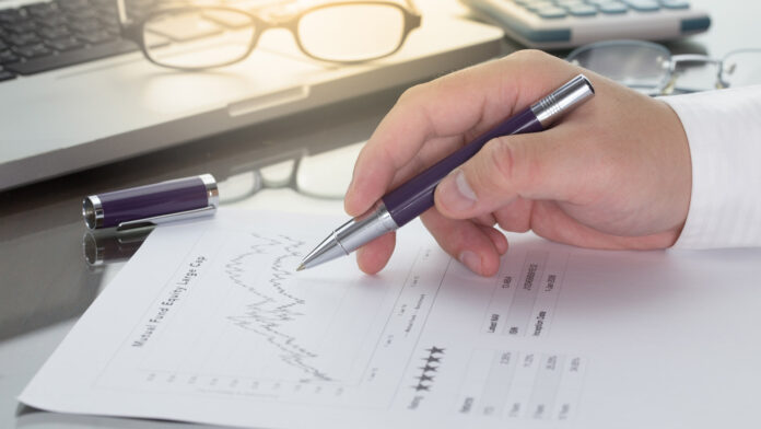 Businessman,Or,Fund,Manager,Review,Mutual,Fund,Information,With,Performance