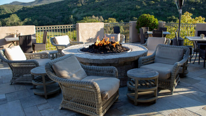 Chairs,And,Side,Tables,Around,Fire,Pit,For,Gathering.