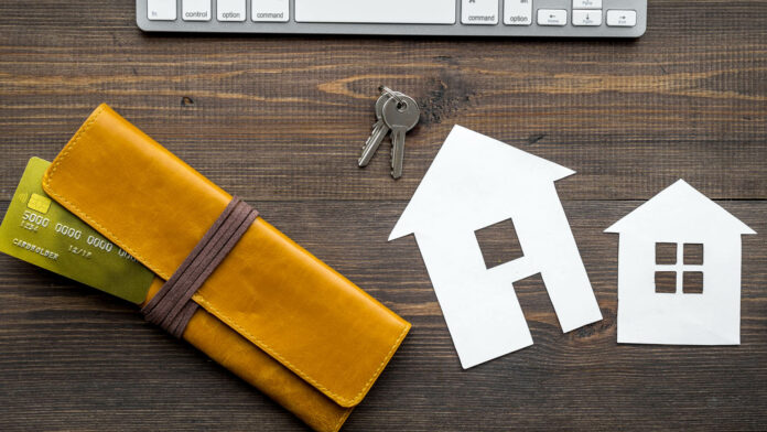 Buy,House,Online,With,Paper,Figures,And,Keys,On,Office