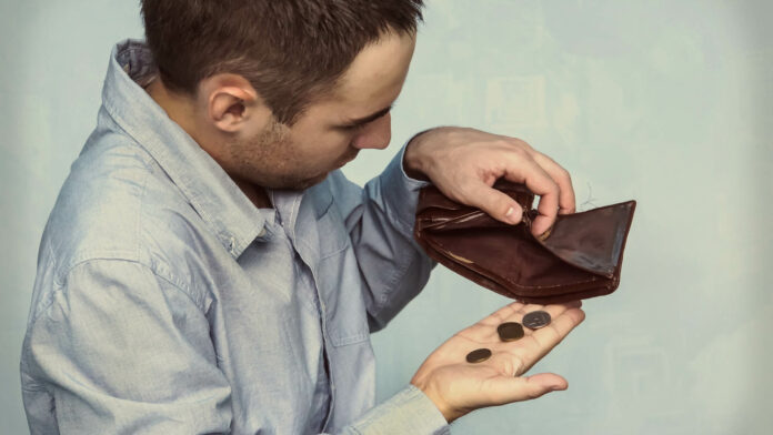 Coins,And,An,Empty,Wallet.,Poor,Man,Pulls,Out,The