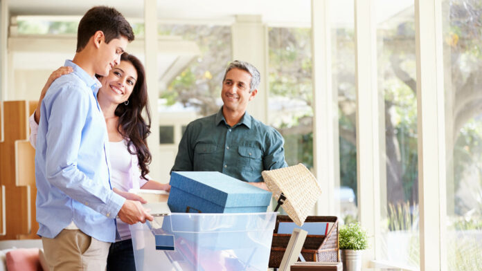 Parents,Helping,Teenage,Son,Pack,For,College