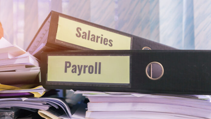 Payroll,And,Salaries,Folders,Stack,With,Label,On,Black,Binder